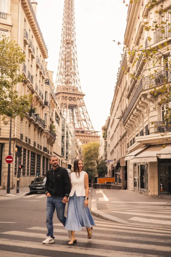 Couple walking Paris street Eiffel Tower summer casual