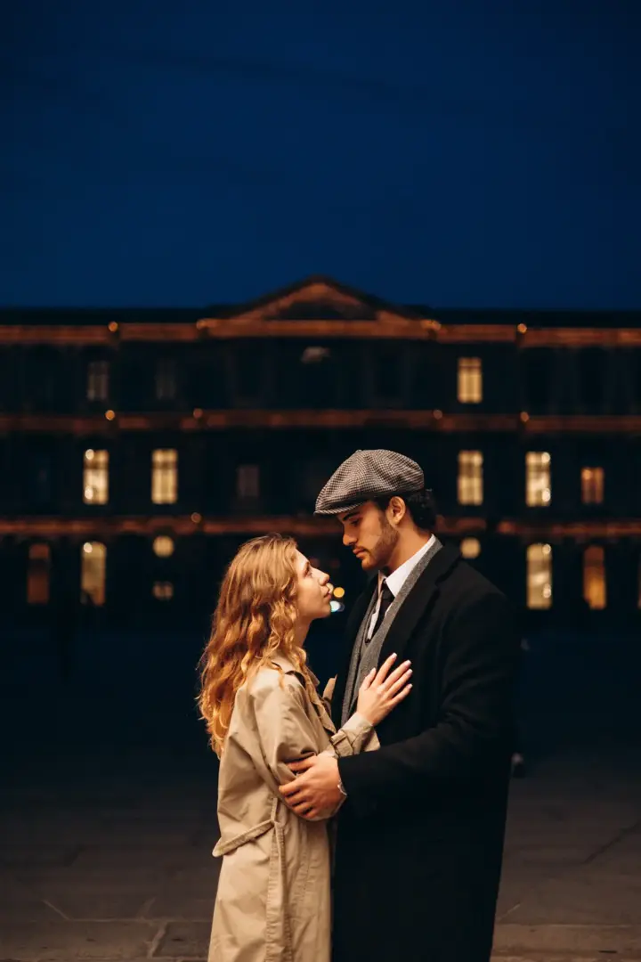 Couple night Louvre courtyard blue hour Paris