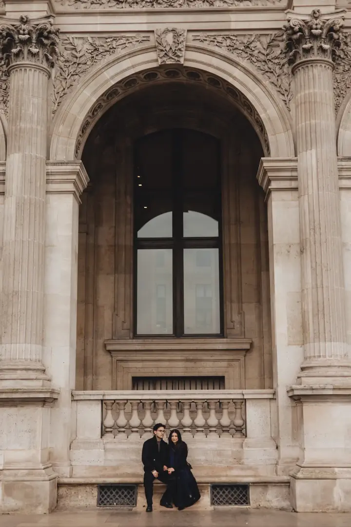 Couple smiling Eiffel Tower golden hour sunglasses Paris
