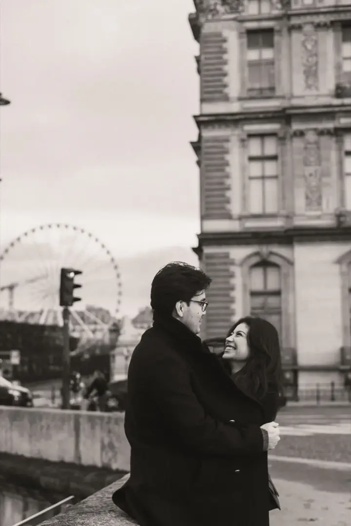 Couple leather jackets rooftop Paris editorial portrait